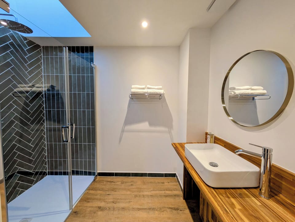 Privilege Family Room | Bathroom | Hair dryer, towels, soap, shampoo