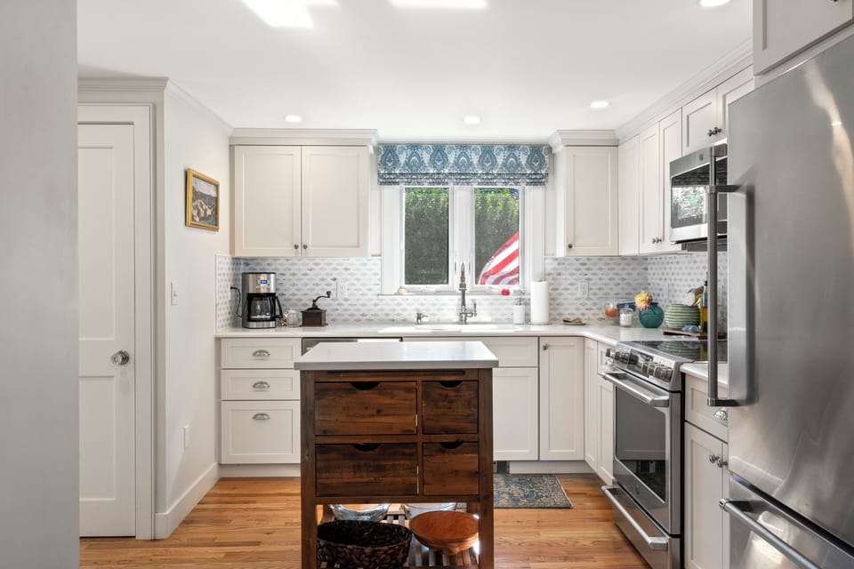 The kitchen is equipped with all the appliances for a home-cooked meal.