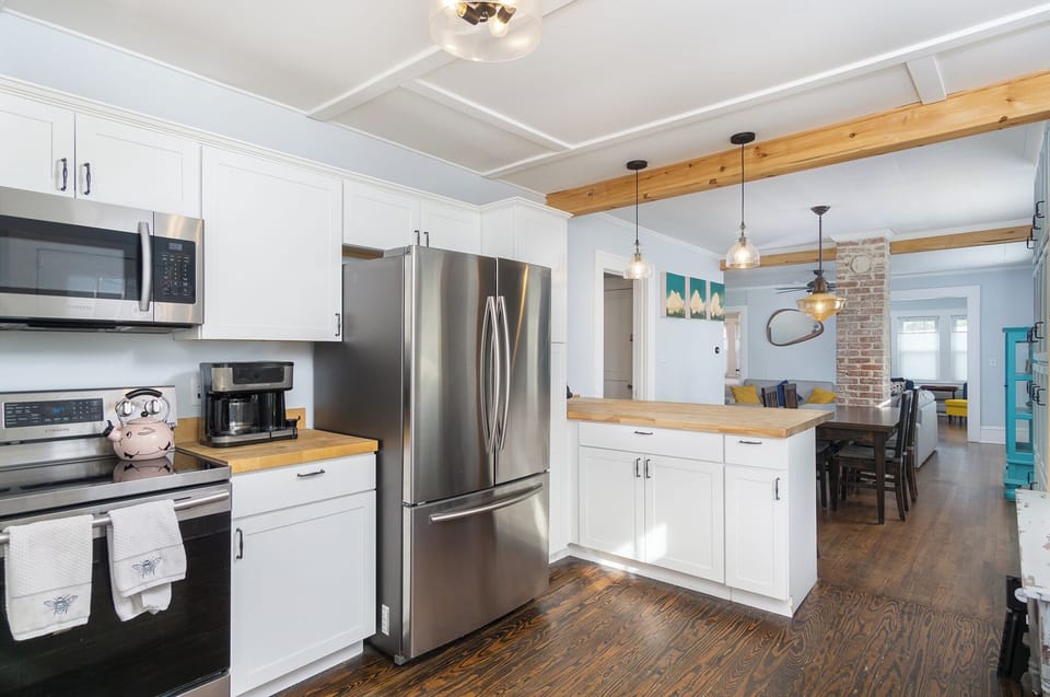Kitchen with dishwasher, tea kettle & standard  Drip-style coffeemaker.