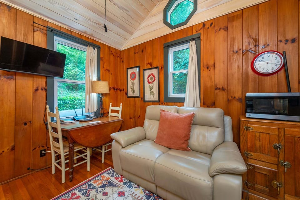 Unwind in the inviting living room, complete with comfortable seating and a Smart TV for streaming your favorite shows.