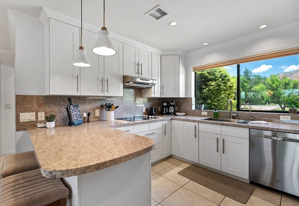 Kitchen is well-equipped with stainless steel appliances