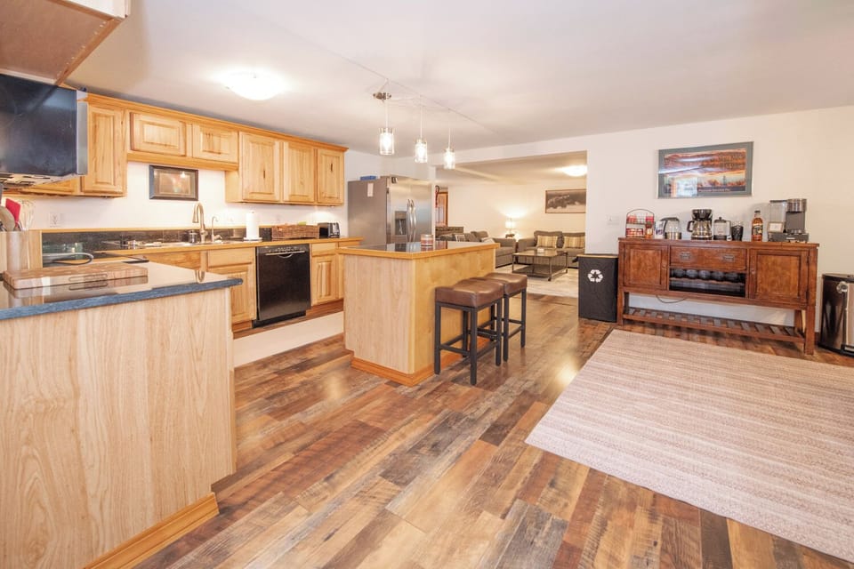 Kitchen with full size refrigerator, dishwasher, oven/stove, microwave, and more