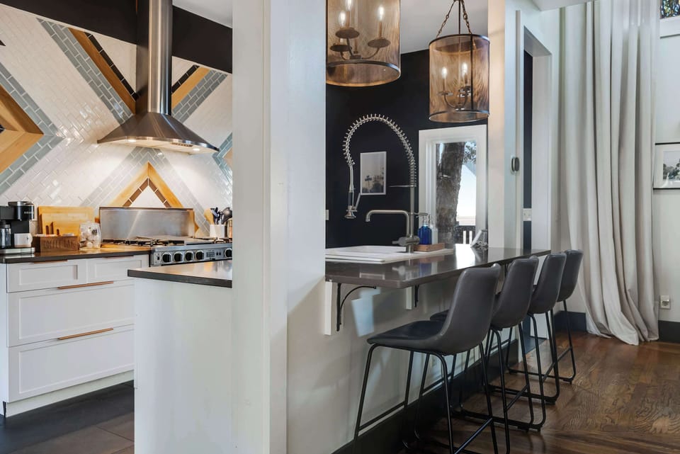 Cook with ease using the professional gas stove, ample prep space, and thoughtfully stocked kitchenware—ideal for group dinners or a cozy night in.