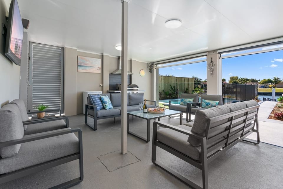 Seanna Blue is a waterfront home with large pool, heated spa, billiard table, large backyard, fire pit and a private pontoon for fishing and kayaking.