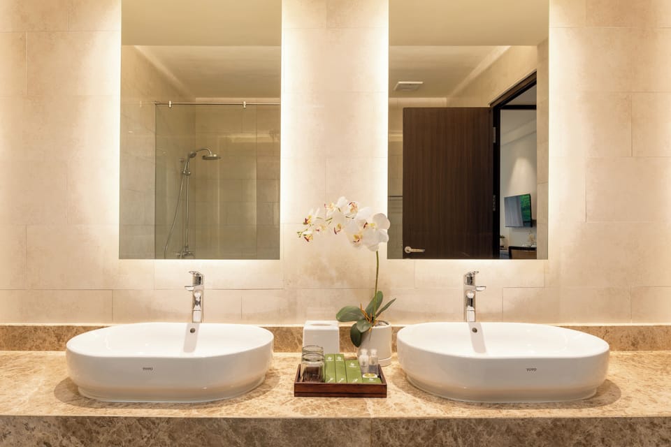 Shower, hair dryer, slippers, towels