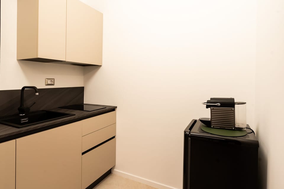Apartment | Private kitchen | Fridge, stovetop, espresso maker, cookware/dishes/utensils