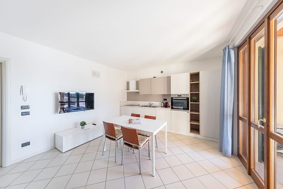 Apartment, Balcony, Partial Lake View | Living area | 35-inch flat-screen TV with digital channels