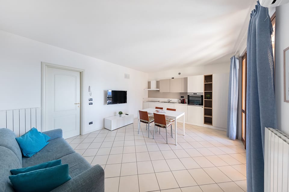 Apartment, Balcony, Partial Lake View | Living area | 35-inch flat-screen TV with digital channels