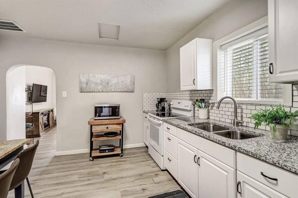 Upgraded kitchen has an electric stove
