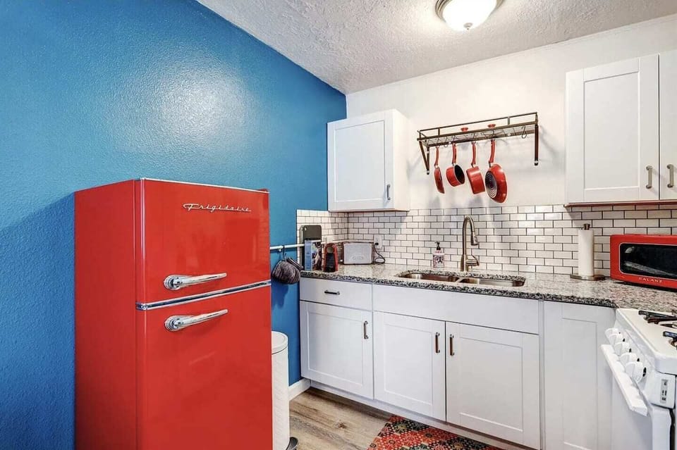 Kitchen includes a gas stove, refrigerator, and microwave