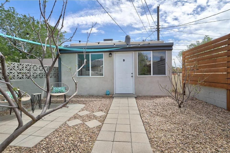 Exterior space includes seating and is full fenced for pets