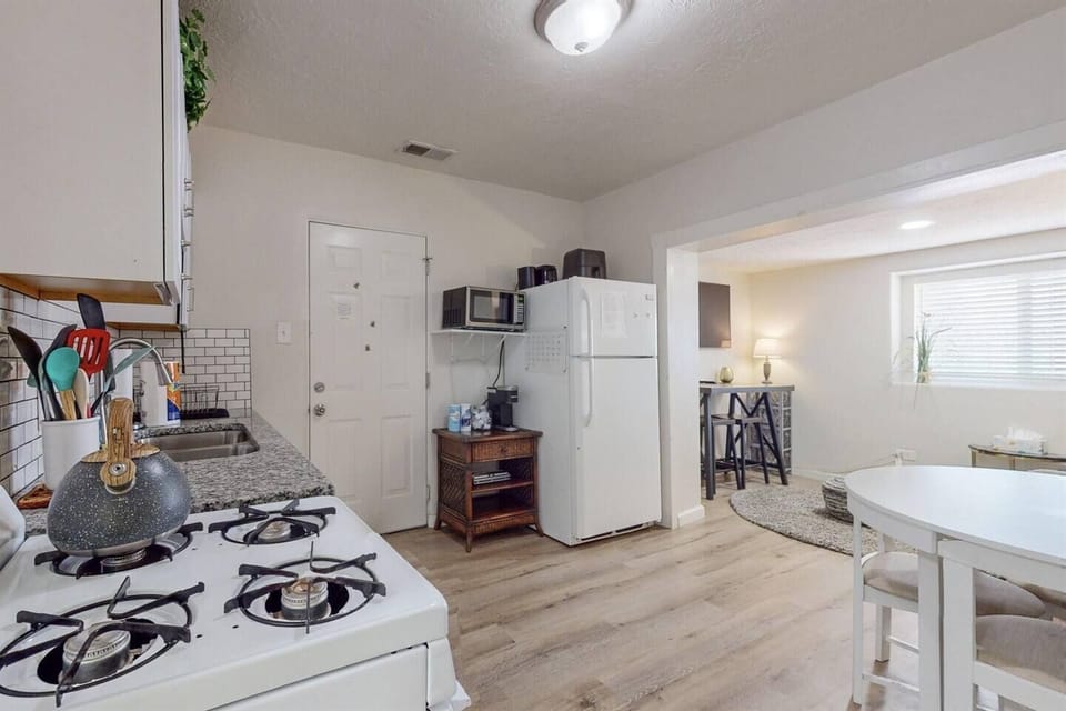 Kitchen opens up to a cozy living room area