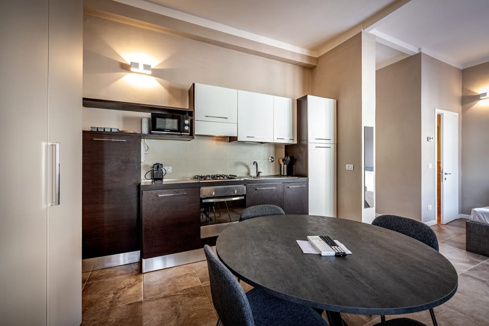 Studio, City View | Private kitchen | Full-size fridge, microwave, oven, stovetop