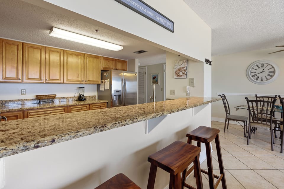 Ocean Breeze East 504 by PKRM - Modern kitchen with granite countertops and breakfast bar!