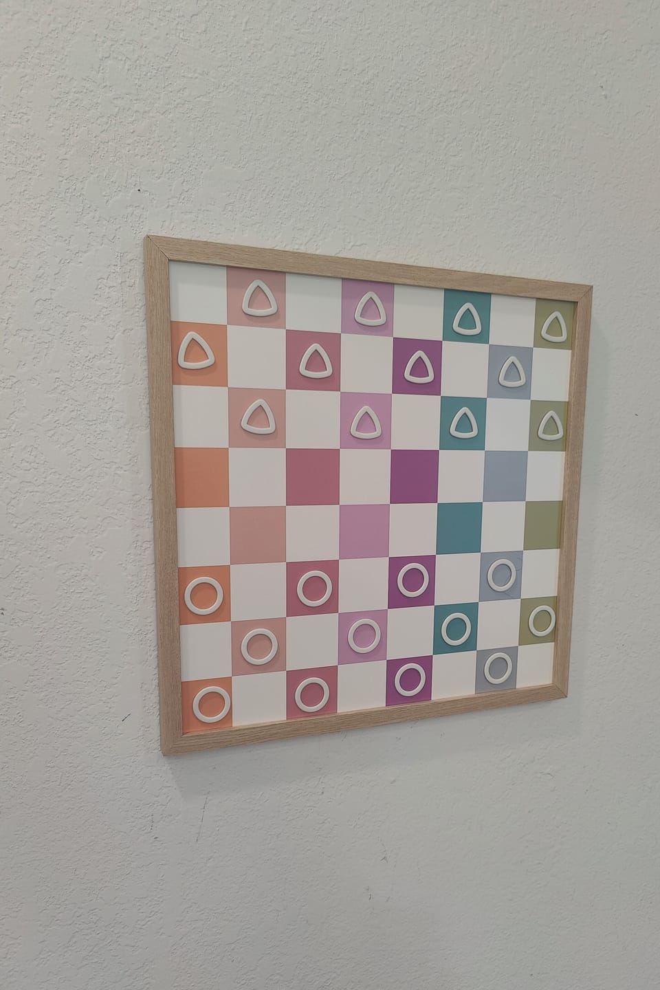 A fun game of magnetic wall checkers located in gaming loft.