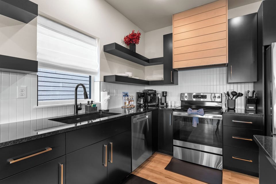 Start your day at the LUX coffee bar featuring a Philips LatteGo 3200 espresso machine and beverage essentials.
