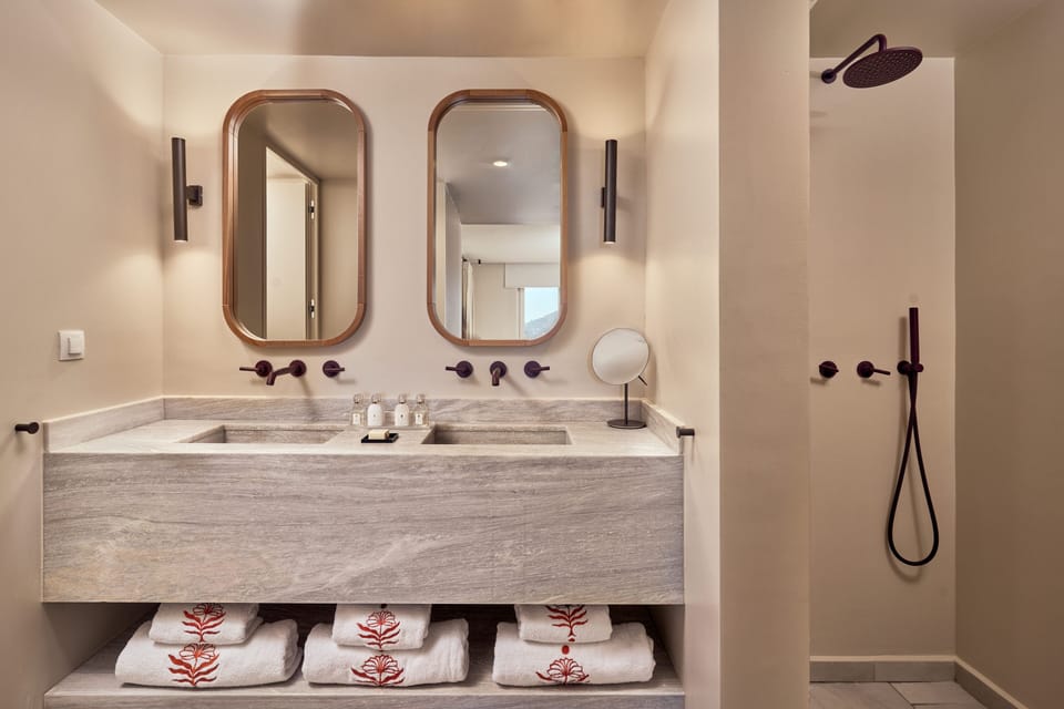 Shower, designer toiletries, hair dryer, bathrobes