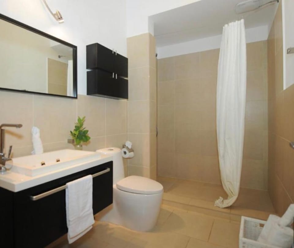 Luxury Condo, Balcony, Garden View | Bathroom | Separate tub and shower, free toiletries, bidet, towels