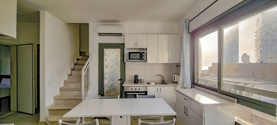 Apartment | Living area | 65-inch flat-screen TV with cable channels
