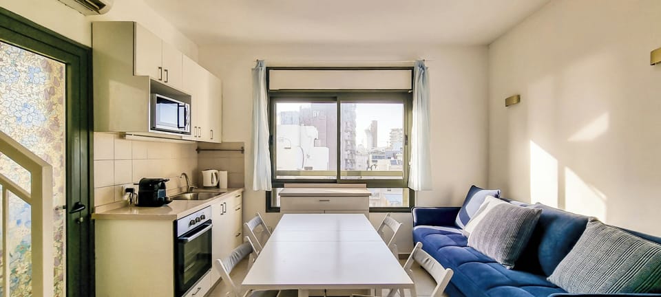 Apartment | Living area | 65-inch flat-screen TV with cable channels