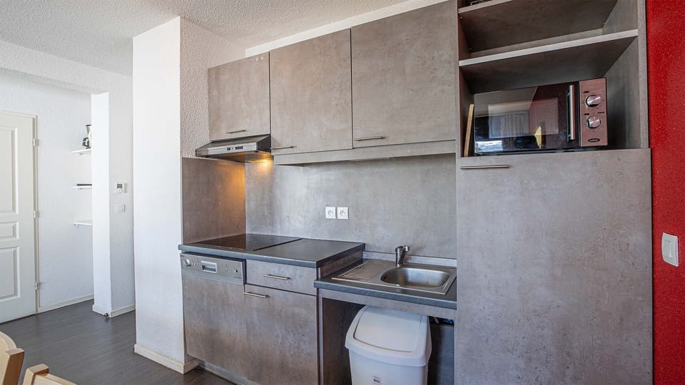 Curb your appetite by cooking a meal in your kitchenette.