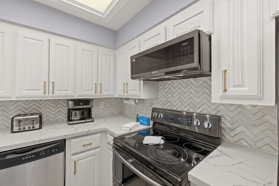 Modern appliances and finishes make meal prep enjoyable.