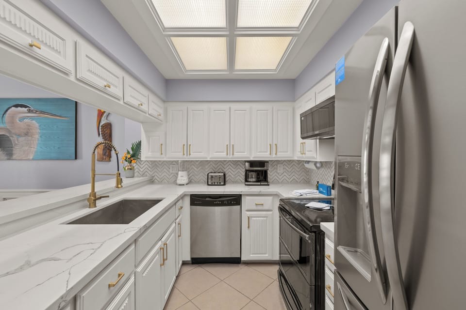 Fully equipped kitchen area with stainless steel appliances