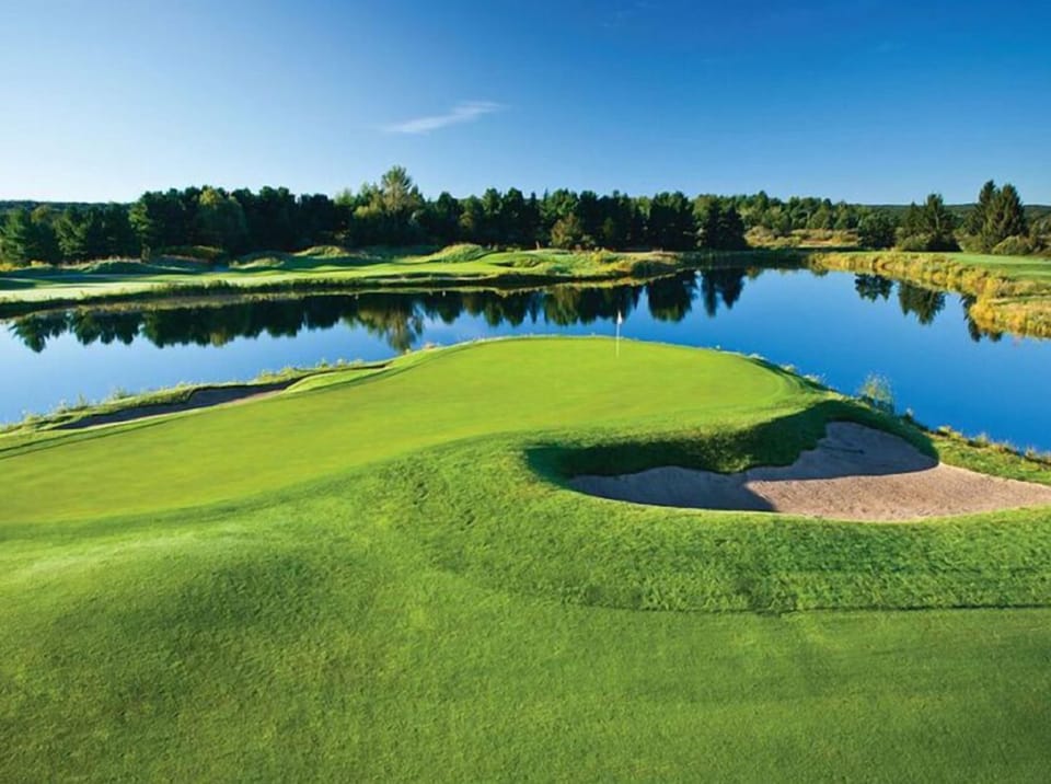 Just a 1/2 mile from this championship golf course at the Grand Traverse Resort.