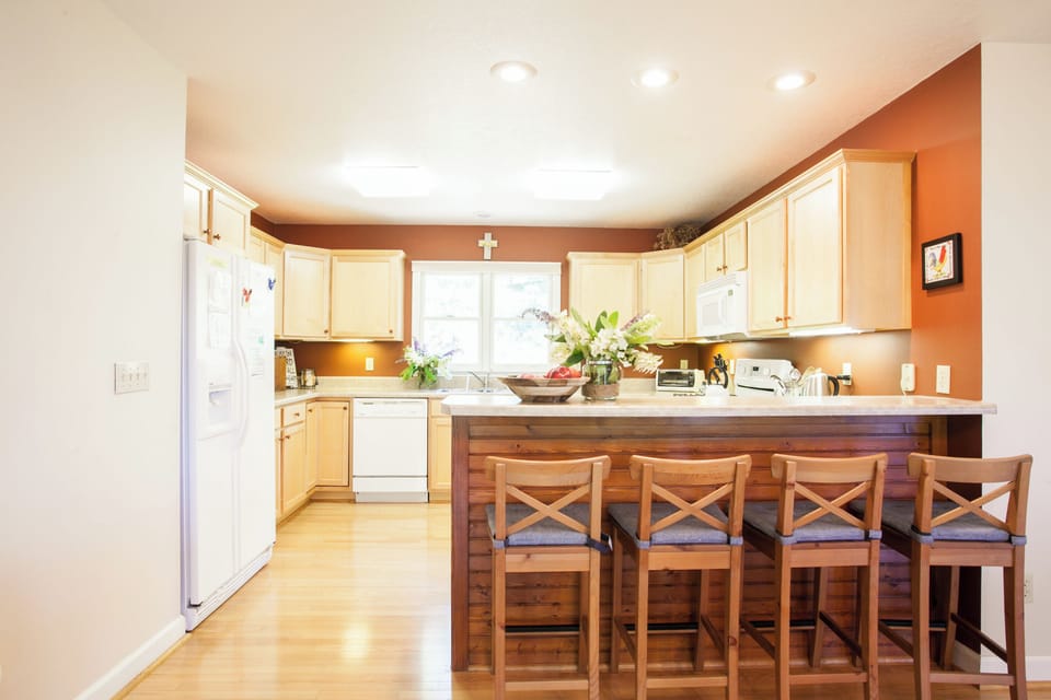 Kitchen includes modern appliances and ample counter space.