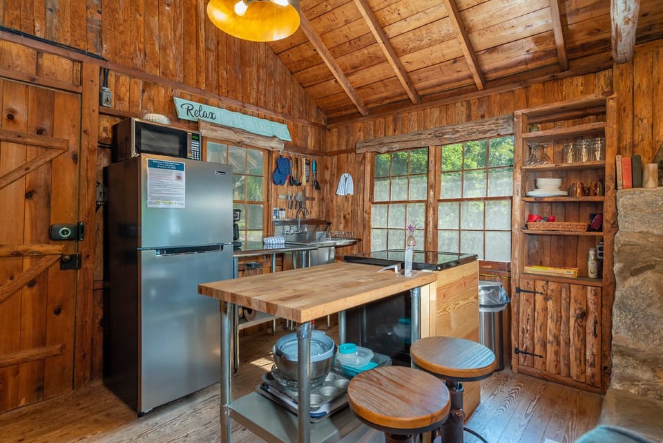 Kitchen with drip-style coffee pot and island seating for 2