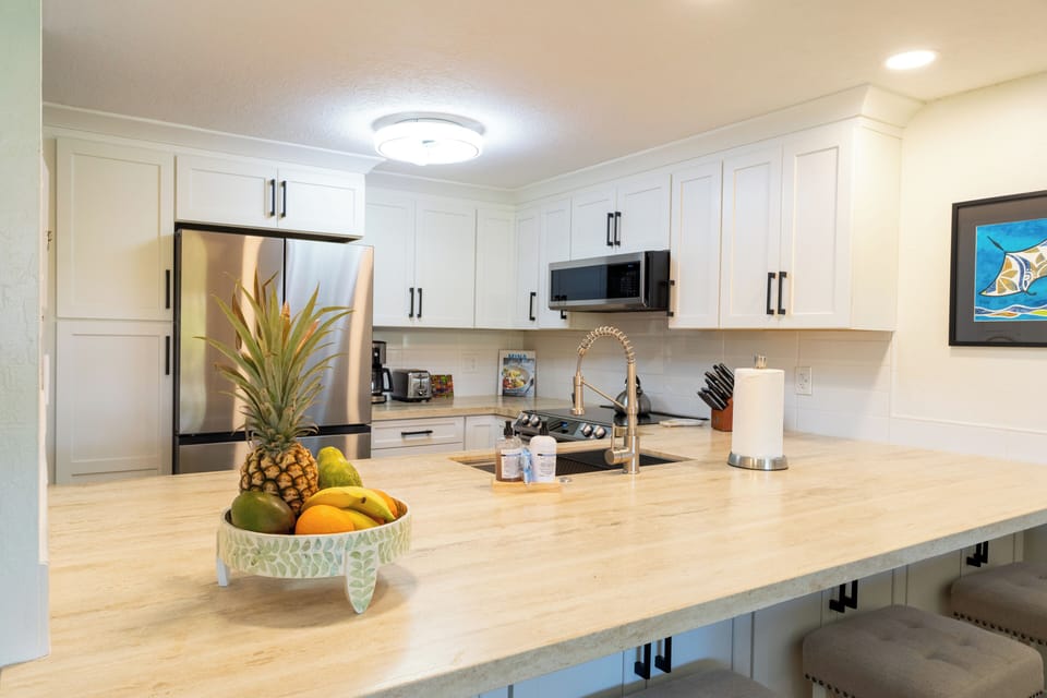 The kitchen is fully stocked with all the essentials for preparing meals.