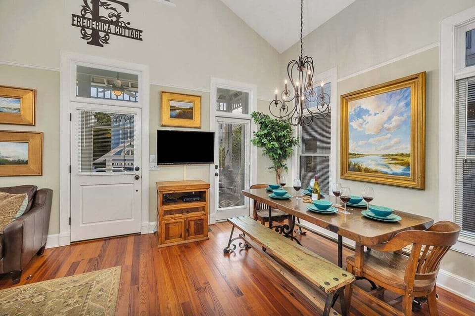 Open-concept dining space with wooden floors