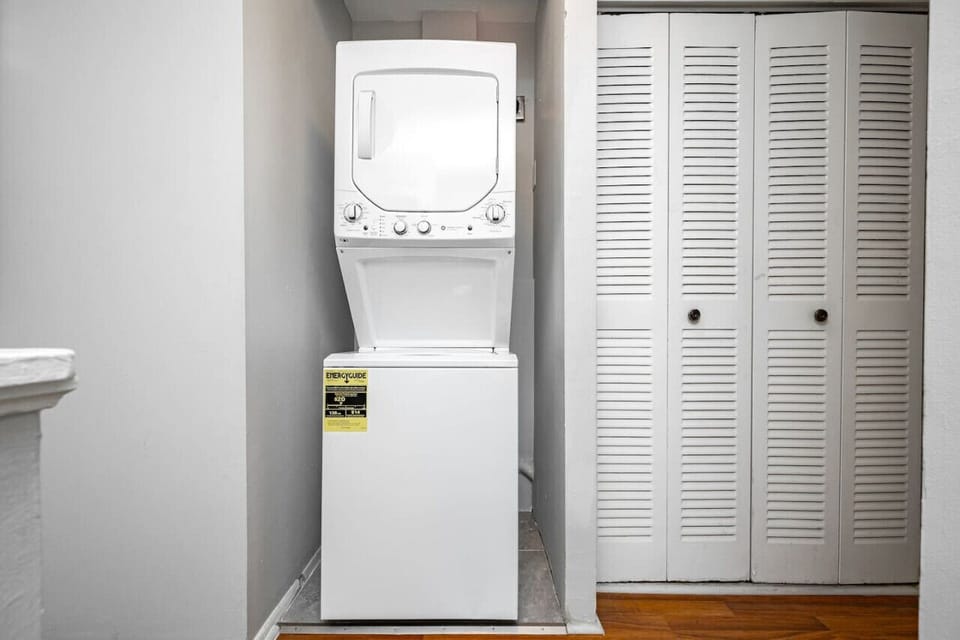 Handy laundry area on the second floor with a stackable washer and dryer.
