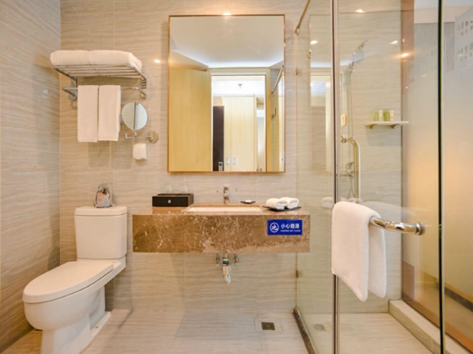 Shower, rainfall showerhead, hair dryer, towels