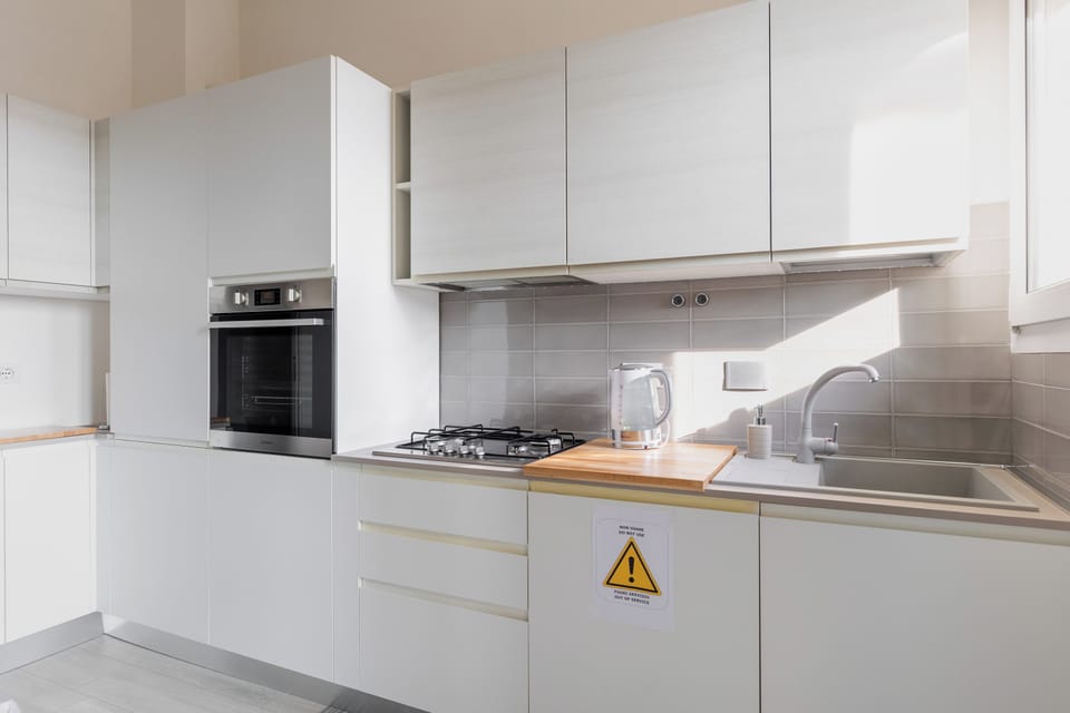 Apartment, Balcony | Private kitchen | Fridge, oven, stovetop, coffee/tea maker