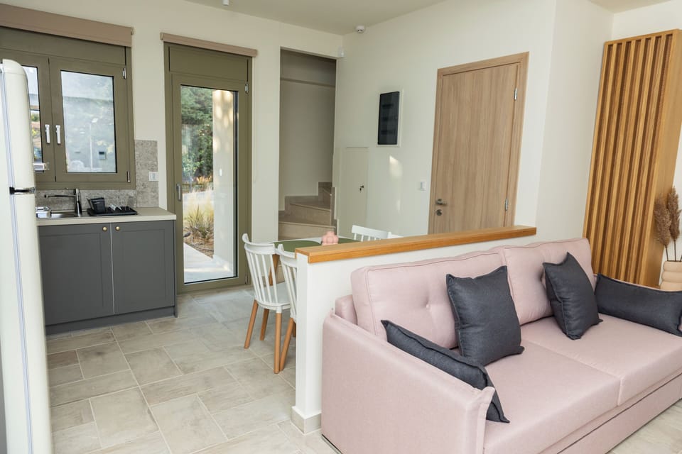 Erato, 2 Bedrooms, Side Sea View | Living area | TV