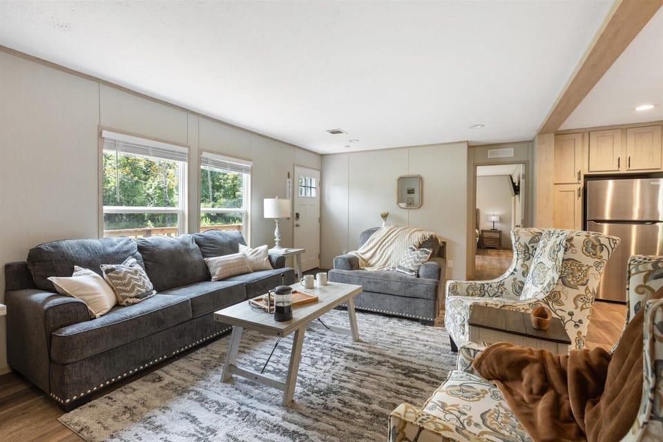 Sink into comfort in our bright, open-concept living area. Whether you're enjoying your morning coffee by the window or curling up for a movie night, this space is designed for total relaxation.