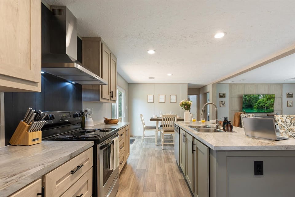 Spacious, modern, and ready for your stay. From the sleek marble-style countertops to the built-in breakfast bar, this kitchen is designed for effortless vacation living.