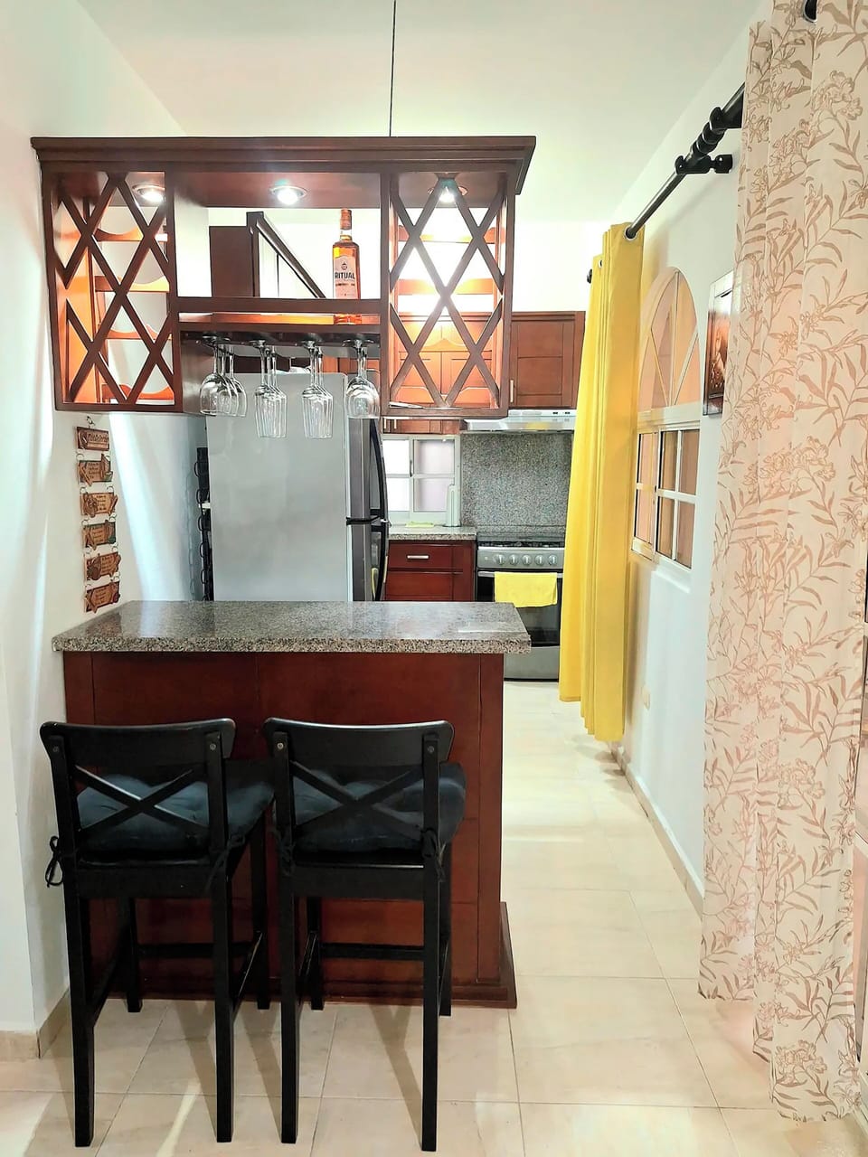 Full-size fridge, microwave, coffee grinder, cookware/dishes/utensils