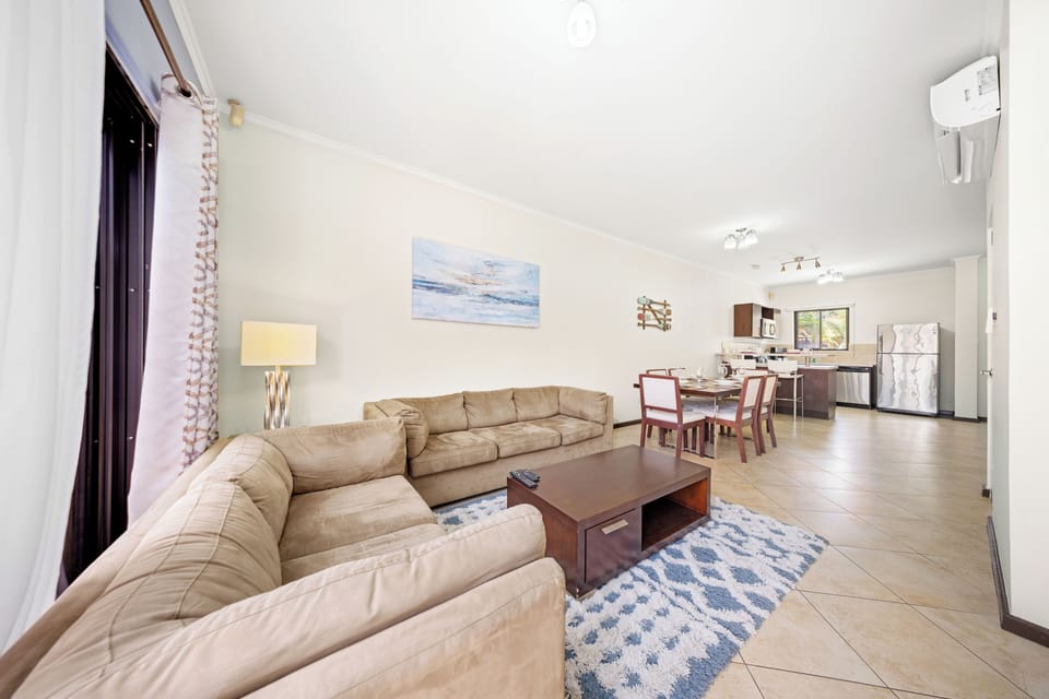 Living area has access to the backyard with glass sliding doors