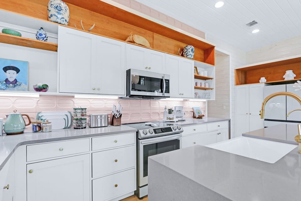 The kitchen is fully stocked with all appliances