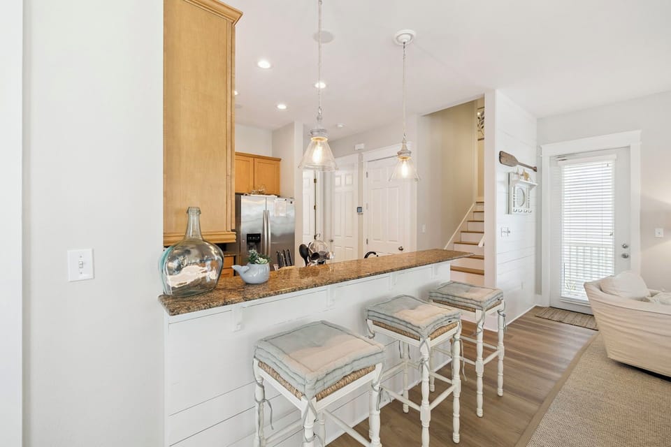 Your open kitchen features granite counters, pendant lighting, and bar seating where you can sip coffee while planning daily adventures.