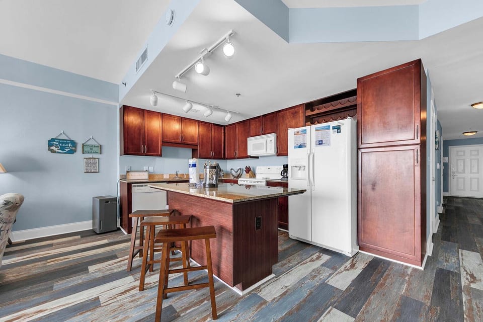 Kitchen island has seating for three