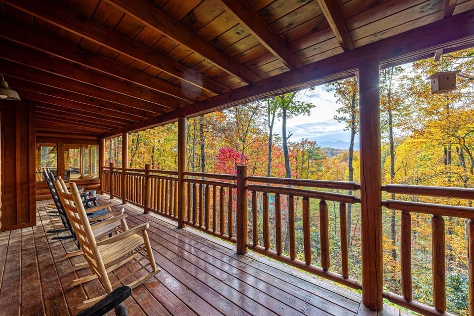 Relax with this mountain view from our spacious decks. Ample seating awaits on our cabin's decks, offering the perfect vantage point to soak in the serene beauty of the Smoky Mountains.