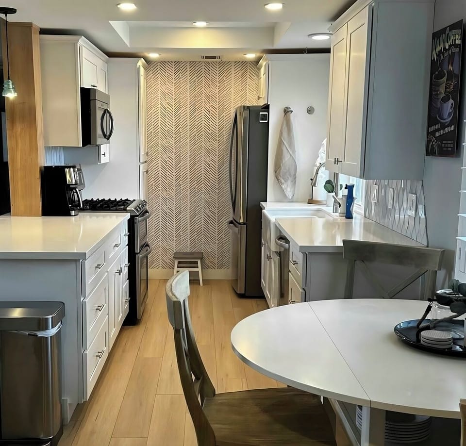 Kitchen- Double oven, convection microwave, gas cooktop, dishwasher, fridg.