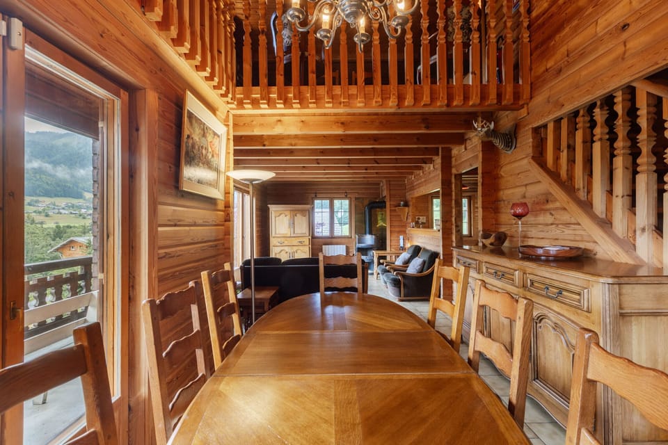 Superb dining room with terrace access for Chalet Henri, available to rent all year round.