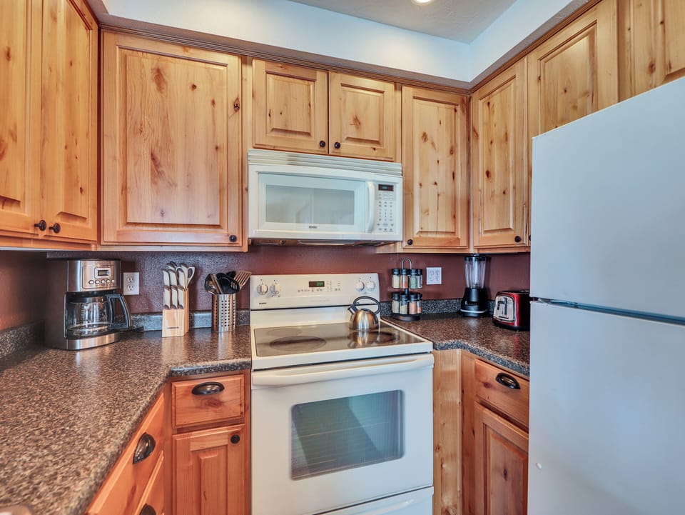 Fully loaded kitchen with, dishwasher, stainless steel sink, microwave, stove and oven