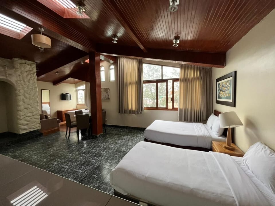 Superior Quadruple Room | Down comforters, in-room safe, desk, laptop workspace