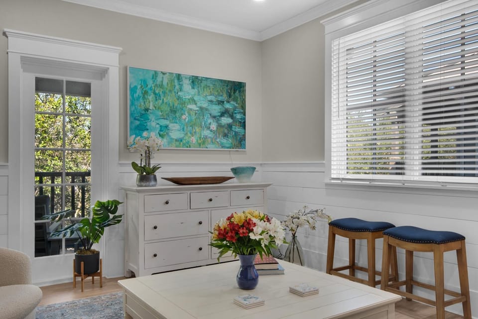 Bright and airy living room with garden views and cozy seating