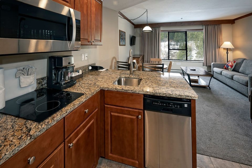 Prepare meals in the fully-equipped kitchen with modern appliances.